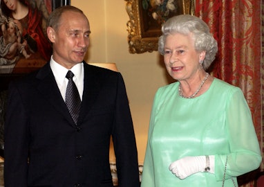 Russia's President Vladimir Putin (L) talks to Britain's Queen Elizabeth II as they arrive for a ban...
