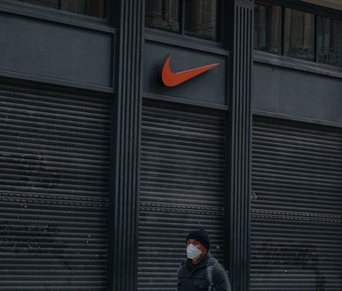 22 April 2020, Istanbul, Turkey - Closed shutters of famous Nike clothing shops on empty Taksim Isti...