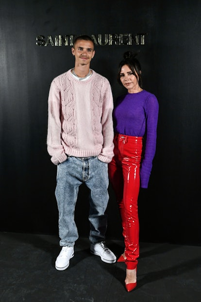 British singer and stylist Victoria Beckham (R) and Romeo Bekcham pose for a photocall prior the Sai...