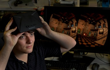 Palmer Luckey, 20, founder, shown at his Irvine office, Oculus Inc., holds a new virtual reality mac...
