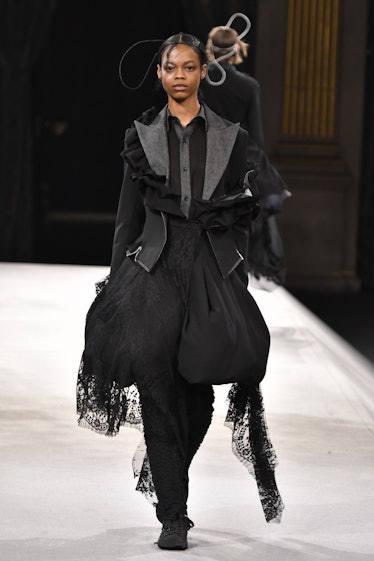 PARIS, FRANCE - MARCH 04: A model walks the runway during the Yohji Yamamoto Ready to Wear Fall/Wint...