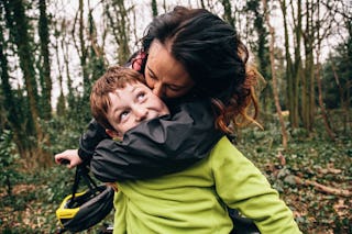 Mother giving her son a kiss on the cheek