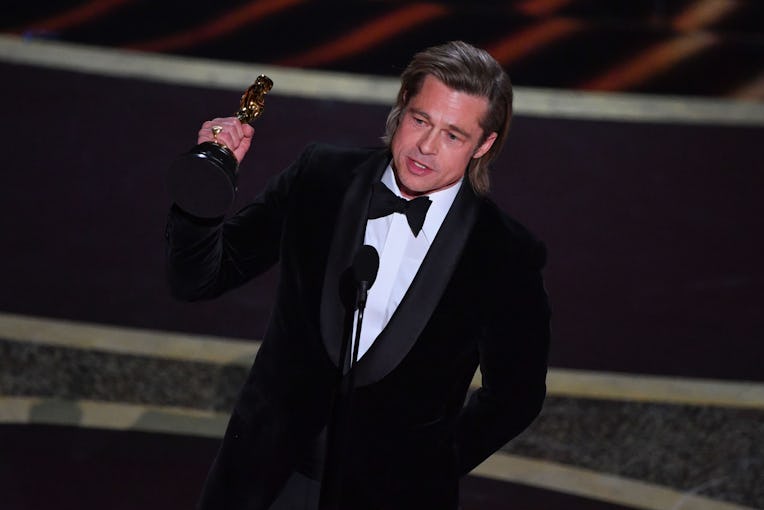 US actor Brad Pitt accepts the award for Best Actor in a Supporting Role for "Once upon a Time...in ...