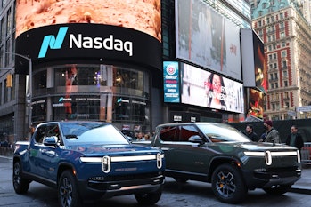 Rivian electric trucks are seen parked near the Nasdaq MarketSite building in Times Square on Novemb...