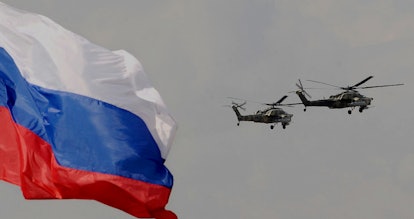 Russian military helicopters perform during an opening ceremony of the MAKS 2009 international aeros...