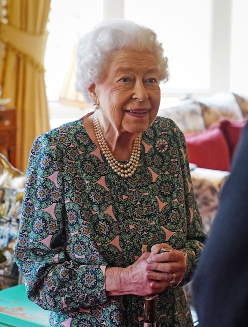 Britain's Queen Elizabeth II (L) speaks with incoming Defence Service Secretaries Major General Eldo...