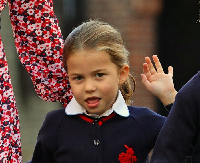 Britain's Princess Charlotte of Cambridge gestures as she arrives for her first day of school at Tho...