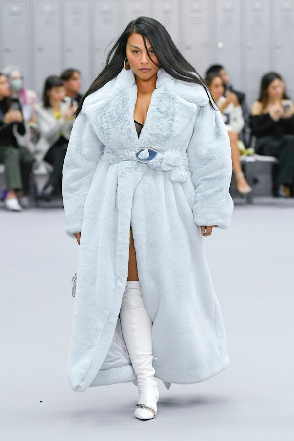 Paloma Elsesser wearing an ice blue plush coat on the Coperni runway