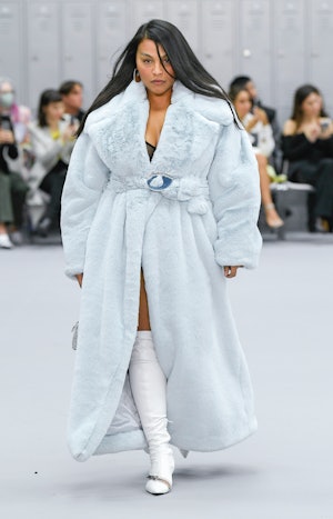 Paloma Elsesser wearing an ice blue plush coat on the Coperni runway