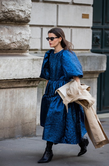 PARIS, FRANCE - MARCH 05: A guest is seen wearing blue dress outside Hermes during Paris Fashion Wee...