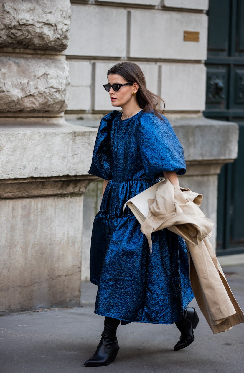 PARIS, FRANCE - MARCH 05: A guest is seen wearing blue dress outside Hermes during Paris Fashion Wee...