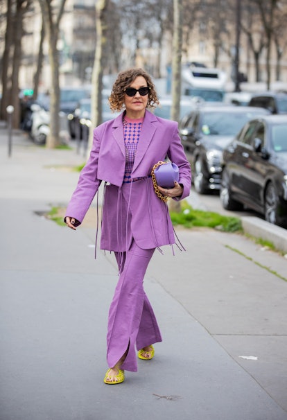 PARIS, FRANCE - MARCH 02: Renia Jaz seen wearing cut out pink blazer, purple pants, bag outside Roch...