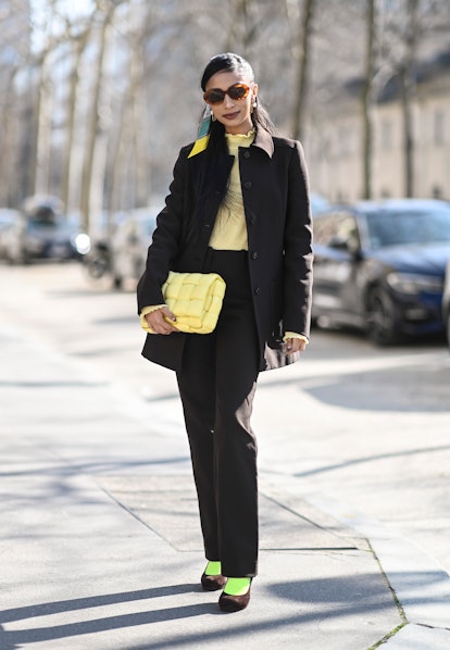 PARIS, FRANCE - MARCH 06: Malvika Sheth is seen wearing a Prada suit, Marc Jacobs turtle neck, Botte...