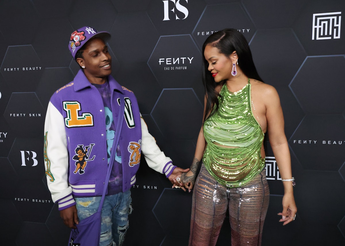 Rihanna and A$AP Rocky pose at a Fenty event.