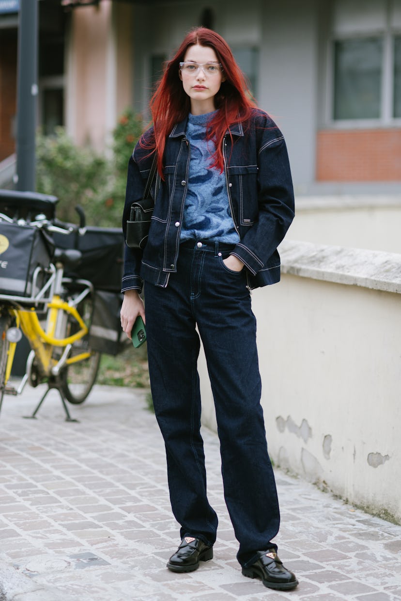 PARIS, FRANCE - MARCH 03: Model Louise Robert poses wearing a C and A Premium jacket and pants and P...