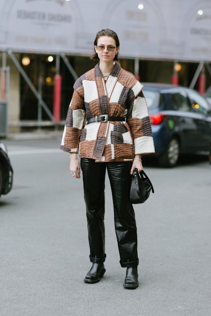 PARIS, FRANCE - MARCH 03: Jacqueline Zelwis poses wearing a patchwork coat and black leather pants a...