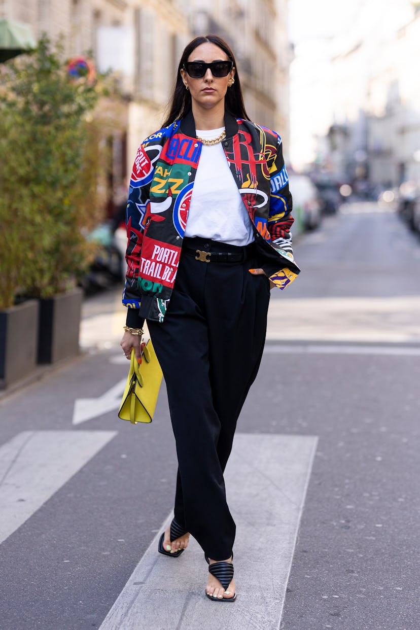 PARIS, FRANCE - MARCH 05: Elisa Taviti wearing a printed jacket, white t-shirt, black pants, Celine ...