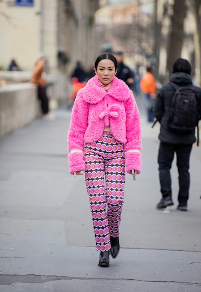 PARIS, FRANCE - MARCH 02: Yoyo Cao seen wearing pink teddy jacket, pants with print outside Rochas d...