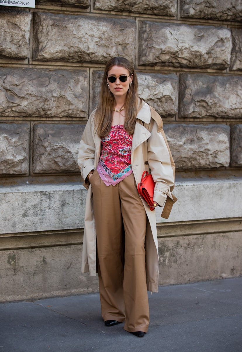 PARIS, FRANCE - MARCH 05: Annabel Rosendahl seen wearing brown pants, beige trench coat, off shoulde...