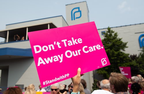 Pro-choice supporters and staff of Planned Parenthood hold a rally outside the Planned Parenthood Re...