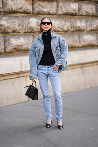 PARIS, FRANCE - MARCH 05: Pernille Teiba wears black sunglasses, diamonds earrings, a black turtlene...
