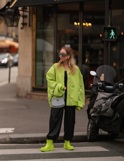 PARIS, FRANCE - MARCH 02: Sonia Lyson is wearing Attico silver shades, Lumina green bomber jacket, T...