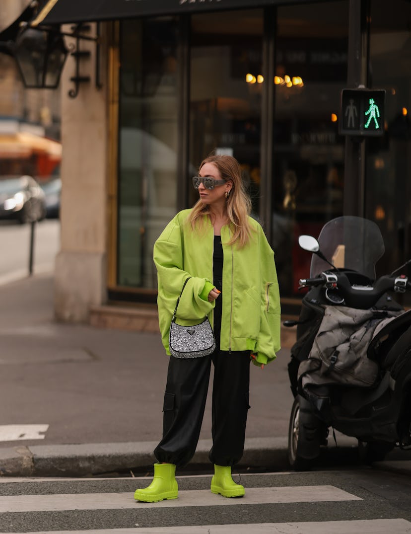 PARIS, FRANCE - MARCH 02: Sonia Lyson is wearing Attico silver shades, Lumina green bomber jacket, T...