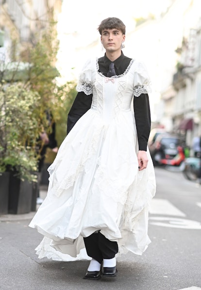 PARIS, FRANCE - MARCH 05: A guest is seen wearing a white wedding dress outside the Vivienne Westwoo...