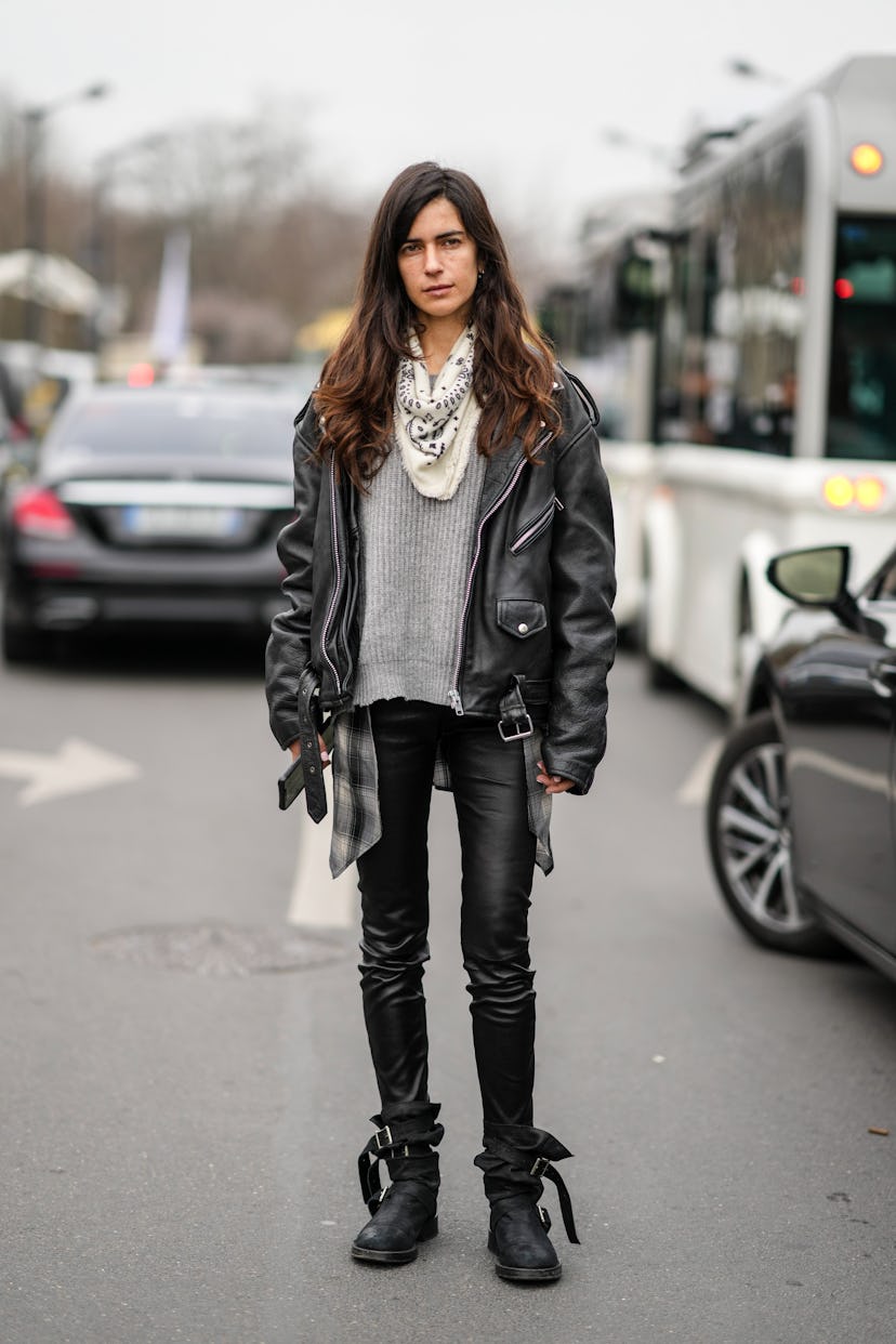 PARIS, FRANCE - MARCH 03: Chiara Totire wears earrings, a white with black print pattern scarf, a gr...