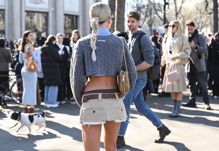 PARIS, FRANCE - MARCH 08:  Caroline Daur seen wearing a gray Miu Miu top and Miu Miu skirt outside t...