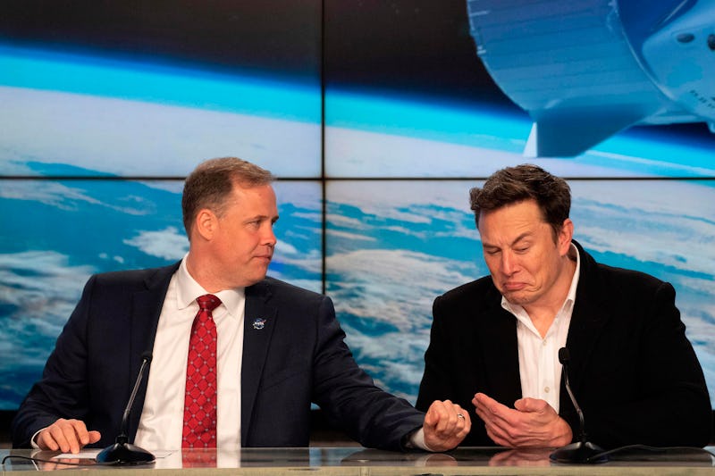 NASA Administrator Jim Bridenstine (L) speaks with SpaceX chief Elon Musk during a press conference ...
