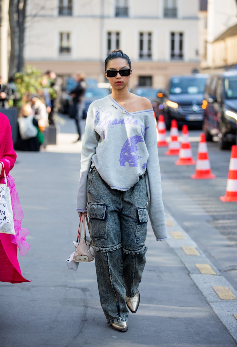 PARIS, FRANCE - MARCH 06: A guest is seen wearing denim jeans with pockets outside Valentino during ...