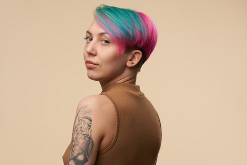 woman with dyed hair and tattoos
