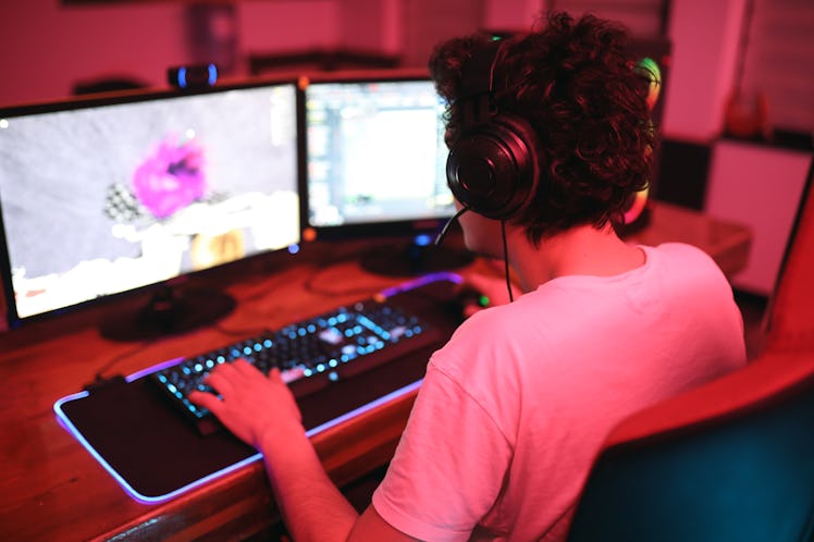 boy playing a video game on a gaming pc