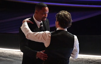 US actor Will Smith (L) speaks with US actor and director Bradley Cooper during the 94th Oscars at t...
