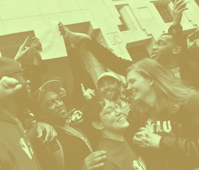 Union organizer Christian Smalls (L) celebrates with Amazon workers following the April 1, 2022, vot...