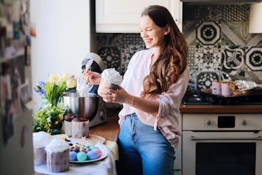 A happy woman in the kitchen makes some Easter recipes from TikTok.