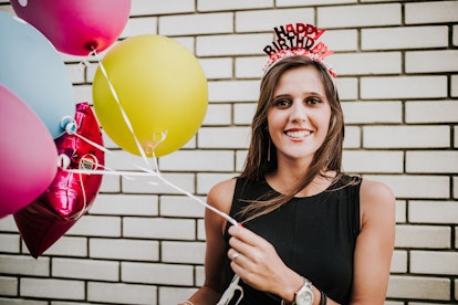 A girl celebrates her birthday with 22 birthday captions and quotes.