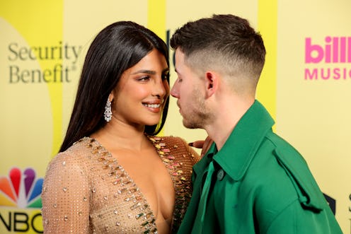 LOS ANGELES, CALIFORNIA - MAY 23: (L-R) Priyanka Chopra Jonas and Nick Jonas pose backstage for the ...