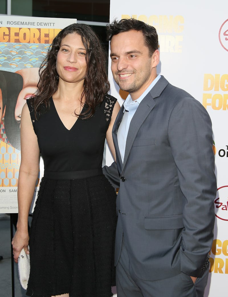 HOLLYWOOD, CA - AUGUST 13: Jake Johnson, right, and his wife Erin Payne attend the premiere of 'Digg...