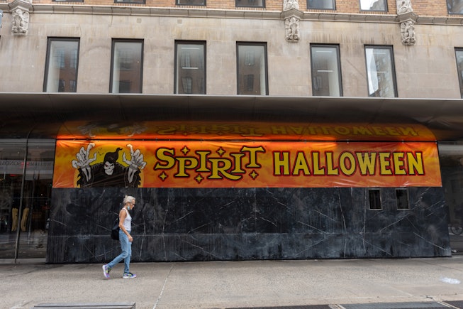 NEW YORK, NEW YORK - AUGUST 20: People walk past a temporary "Spirit Halloween" store set up at 101 ...
