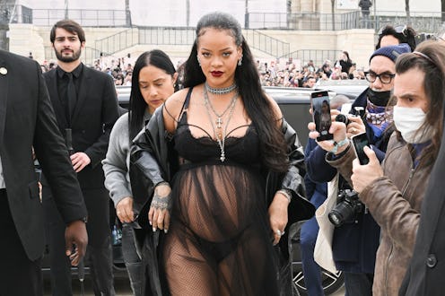 PARIS, FRANCE - MARCH 01: Rihanna attends the Dior Womenswear Fall/Winter 2022/2023 show as part of ...