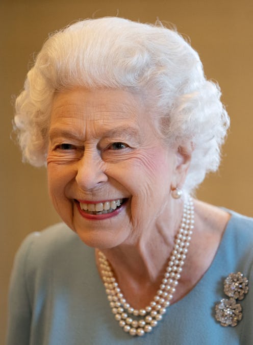 TOPSHOT - Britain's Queen Elizabeth II smiles during a reception in the Ballroom of Sandringham Hous...