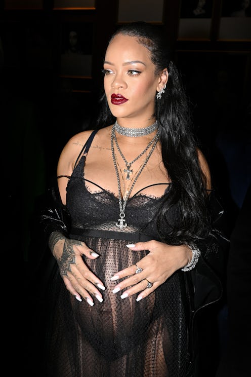 PARIS, FRANCE - MARCH 01: Rihanna attends the Dior Womenswear Fall/Winter 2022/2023 show as part of ...