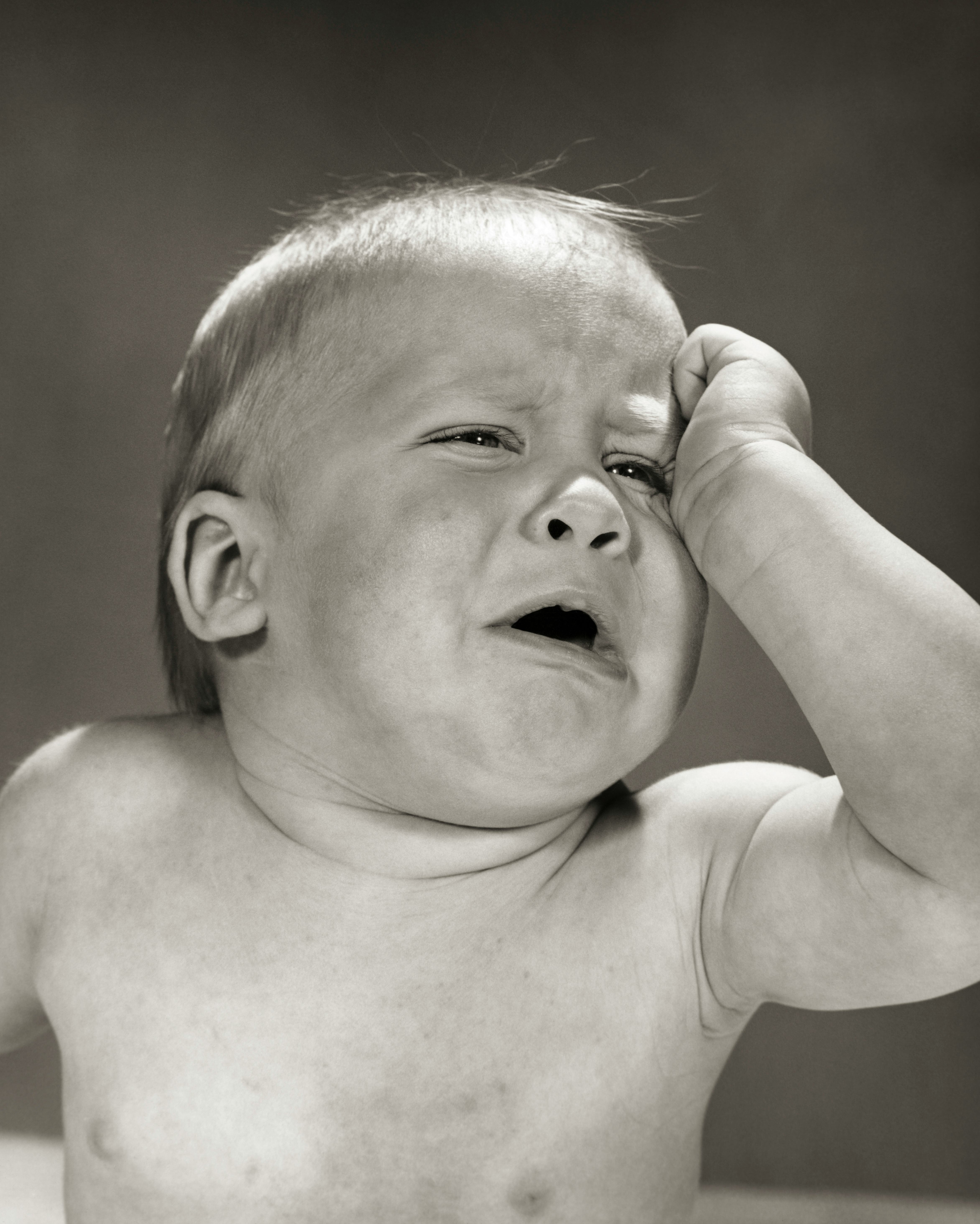 1960s BABY CRYING MELODRAMATIC CROCODILE TEARS HOLDING HAND TO EYE
  (Photo by H. Armstrong Roberts/...