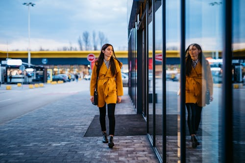 A woman views her reflection in a mirror. An astrologer explains the meaning of Life path number 2.