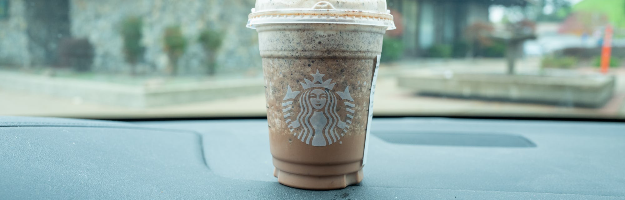 Starbucks Frappuccino beverage on the dashboard of a vehicle, Moraga, California, December 4, 2021. ...