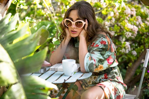 A cynical woman looks bored at the camera. An astrologer reveals the most cynical zodiac signs.
