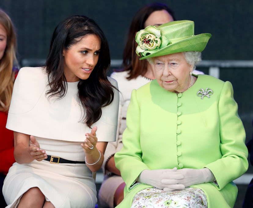 Meghan Markle, wearing white, sits beside Queen Elizabeth, in lime green, in 2018. Harry and Meghan ...