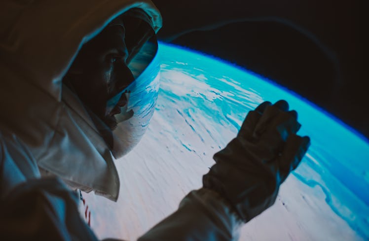 digital rendering of an astronaut looking at earth
